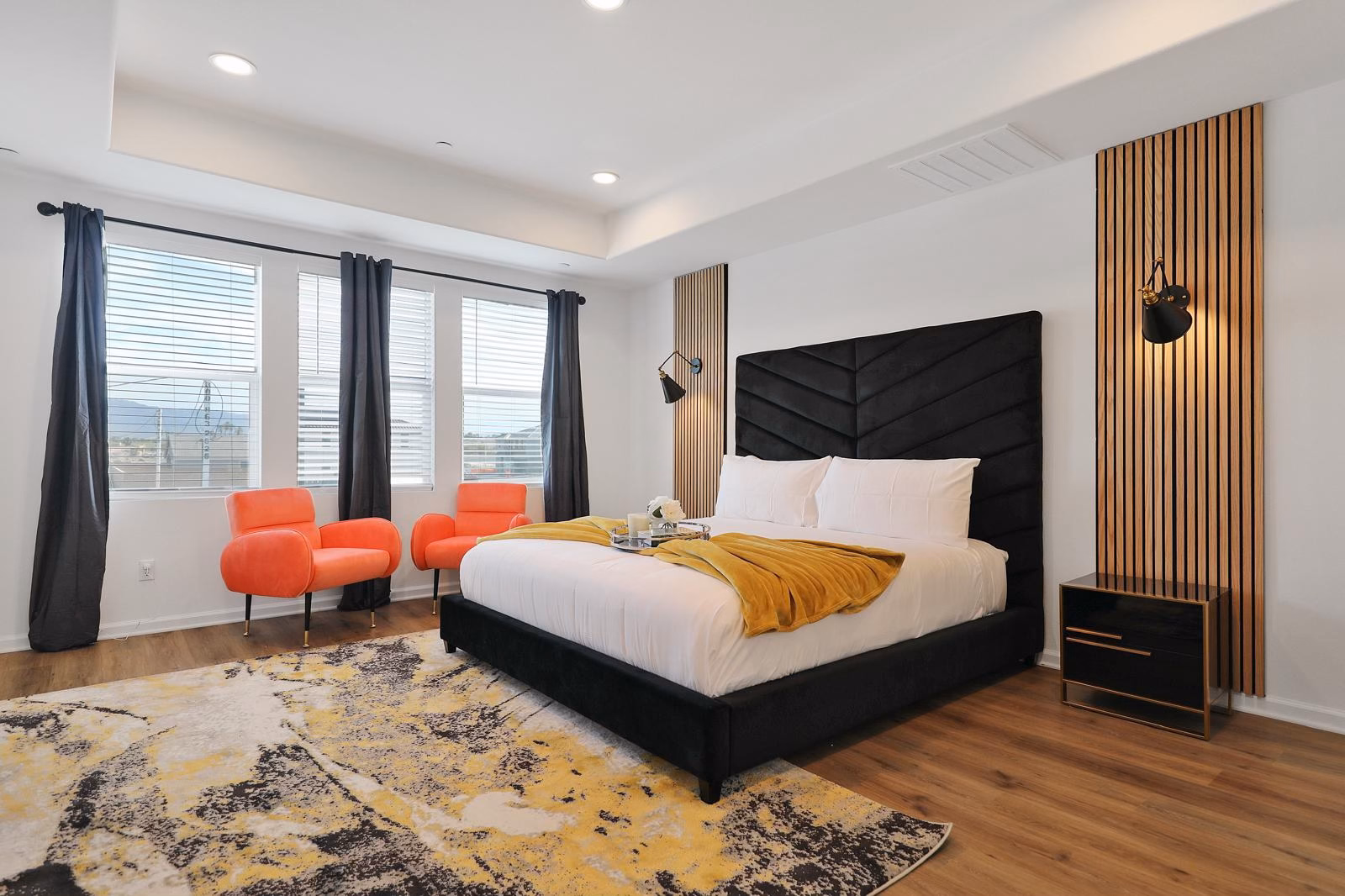 Luxury master bedroom with statement headboard and designer accents - each bedroom requires 45-60 minutes of detailed turnover work that SixThree8 tracks down to the minute with GPS-verified time tracking
